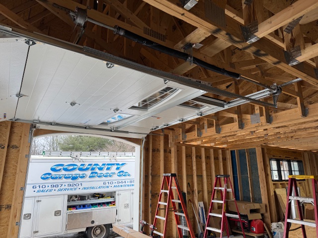 view of an opened garage door with custom installed opener tracks