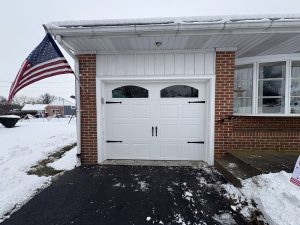 new garage door with windows and handles