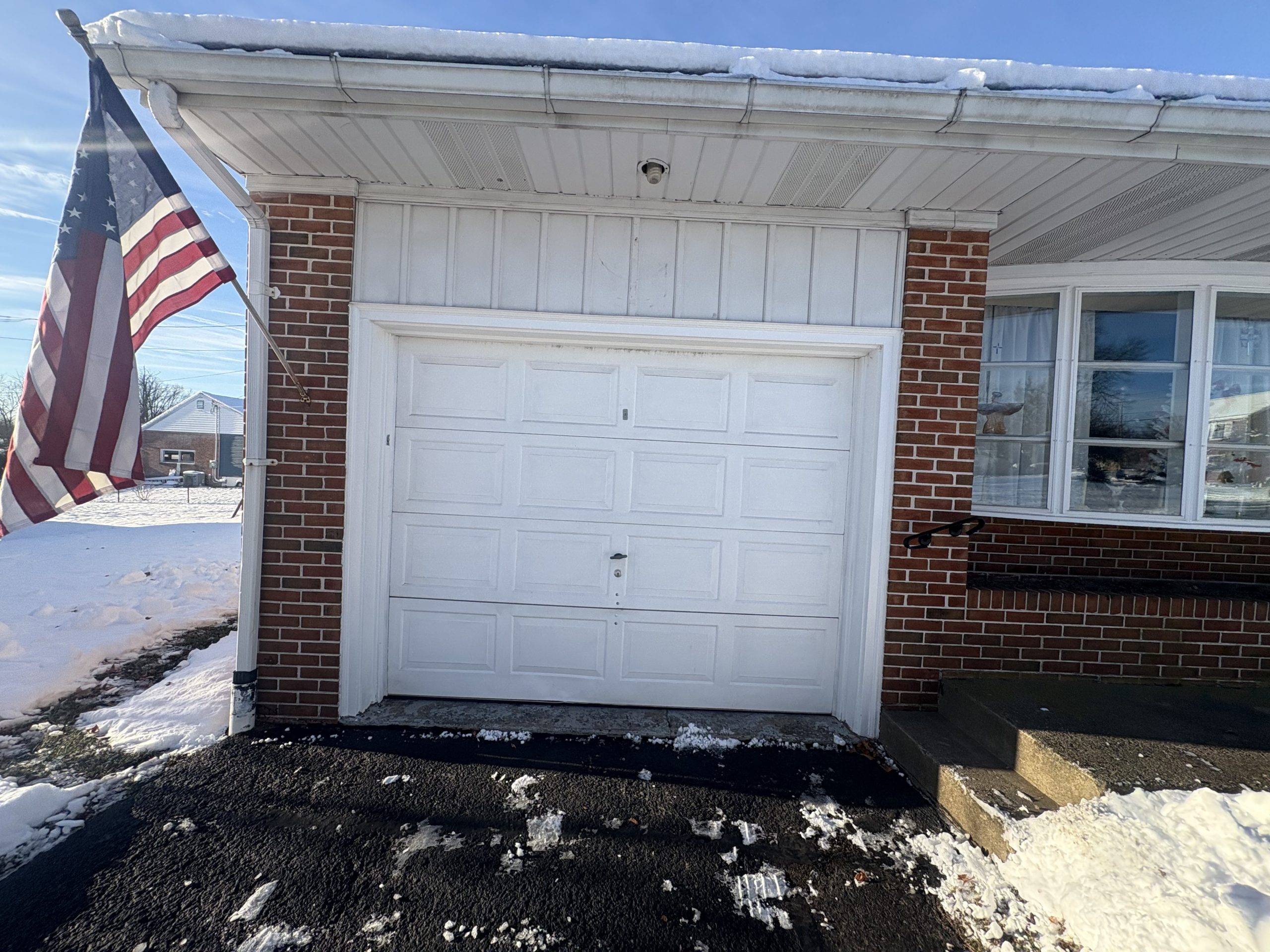 old white garage door on an attached garage