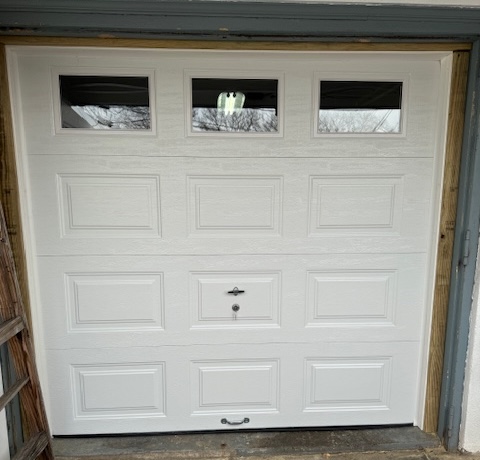 Garage door with glass windows at the top
