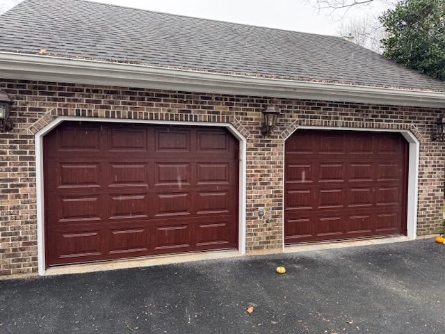 replacement garage door in a strong maroon