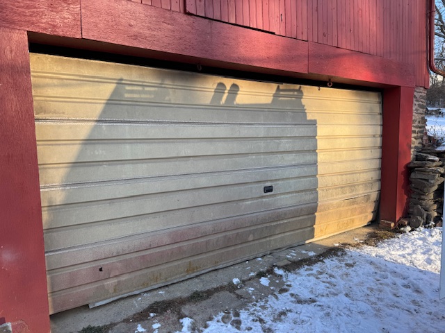 weathered and worn garage door